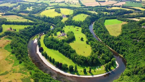Aerial-Pullback-Shot-of-The-River-Tweed-in-Scottish-Borders-Near-Melrose,-Scotland