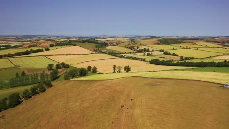 Aerial-Shot-of-Scottish-Countryside,-Fields-in-the-Scottish-Borders-on-Hot-Summers-Day,-Scotland