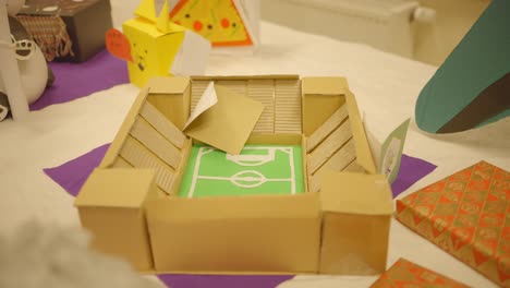 DIY-Football-stadium-model-made-out-of-paper-and-cardboard-for-December-festivity