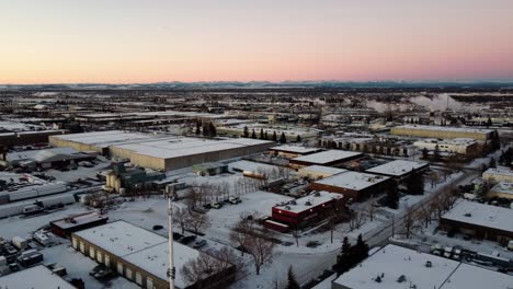 Sunrise-Over-Calgary's-Industrial-Warehouses-with-Rocky-Mountains-in-the-Background