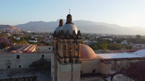 Aerial-of-Impressive-Catholic-Church-in-Oaxaca-with-red-domes-and-towers