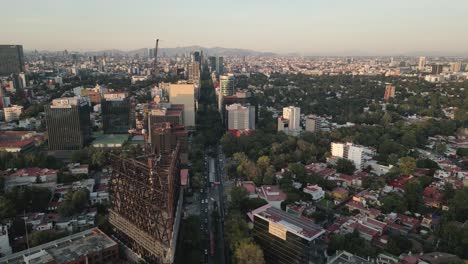 Birds-eye-view-of-buildings-on-Insurgentes-Avenue-in-Mexico-City,-taken-from-a-drone