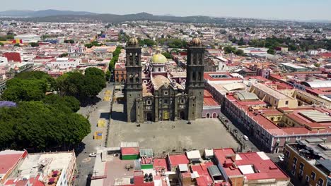 Aerial-of-historic-Catholic-Church-with-spires-and-dome-in-Oaxaca-de-Juarez---Mexico
