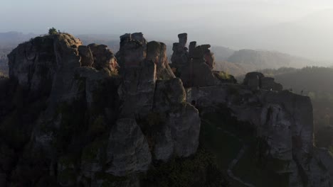 Orbiting-drone-shot-around-the-famous-tourist-destination-located-in-Vidin-province,-the-natural-rock-formations-of-the-historical-Belogradchik-fortress,-in-Bulgaria