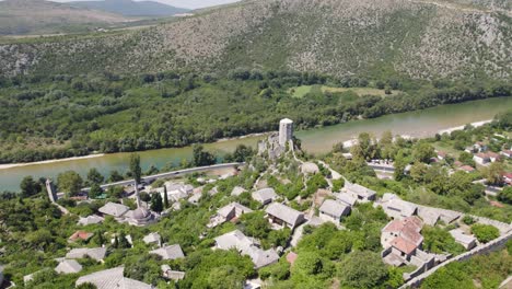 Aerial-orbit-medieval-city-Pocitelj,-castle-and-minaret,-Bosnia-and-Herzegovina
