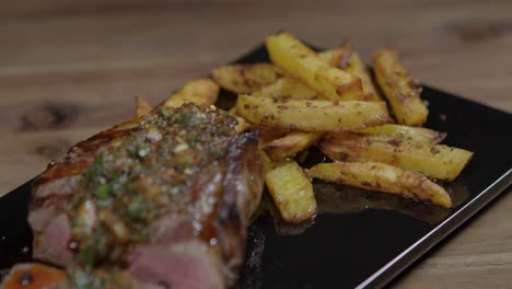 Meat-and-french-fries-with-chimichurri-sauce,-argentinian-food