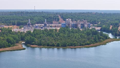 Moving-to-the-right-above-a-lake-that-has-a-power-plant-behind-it