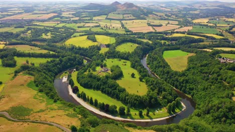 Aerial-View-Revealing-The-River-Tweed-and-Eildon-Hills-in-The-Scottish-Borders,-Scotland,-United-Kingdom