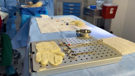 An-operating-table-set-up-for-ophthalmological-surgery,-equipped-with-surgical-instruments