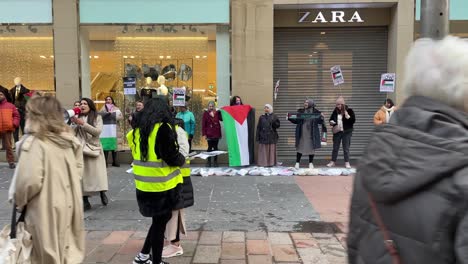 Hand-held-shot-of-Palestinian-protesters-protesting-for-a-ceasefire-in-Glasgow