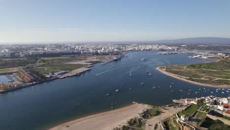 Panorama-aerial-view-skyline-Ferragudo-in-Portugal,-scenic-cityscape,-copyspace