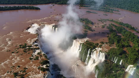 Drone-unveiling-the-beauty-of-Iguazu-Falls,-capturing-the-enchanting-allure-and-natural-splendor-as-it-explores-the-cascading-waters-from-a-captivating-aerial-perspective