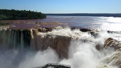 Breathtaking-viewpoint-of-Iguazu-Falls-from-the-Argentine-side,-perched-atop-the-majestic-Devil's-Throat,-capturing-the-awe-inspiring-beauty-of-this-natural-wonder