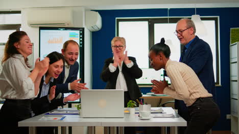 Happy-creative-business-team-having-meeting-in-broadroom-office
