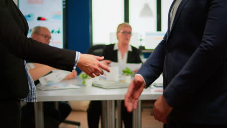 Satisfied-businessman-company-employer-wearing-suit-handshake-new-employee