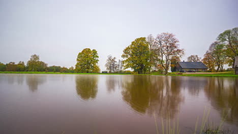 Time-lapse-of-a-lakeside-house-during-changing-seasons-and-weather-conditions