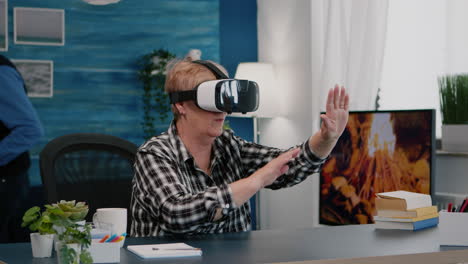 Retired-woman-experiencing-virtual-reality-using-vr-headset-at-home