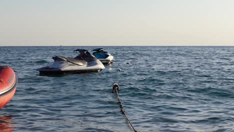 Static-shot-of-jet-ski-parked-in-the-water-in-sunset