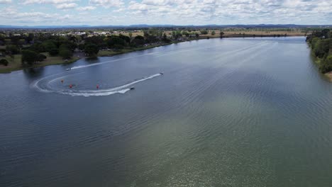 Aerial-View-Of-Motorboats-Speeding-And-Leaving-Wake-On-Clarence-River