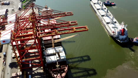 Panoramic-drone-shot-of-containers-and-ship,-customs