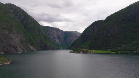 Aerial-dolly-over-stunning-large-fjord-under-cloudy-sky-on-Norway's-west-coast