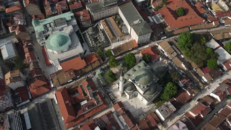 Drone-view-of-the-historical-library-building-built-in-the-name-of-Gazi-Husrev-bey,-cultural-buildings-in-the-streets-of-the-city-made-by-Ottoman-architects-in-Sarajevo-City
