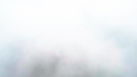 Aerial-view-through-fog-clouds,-revealing-the-Golden-gate-bridge,-in-California,-USA