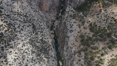 Drone-view-of-the-valley-between-the-mountains,-view-of-the-deep-canyon-from-above