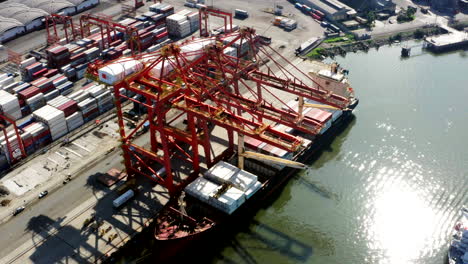 Panoramic-drone-shot-of-containers-and-ship,-customs