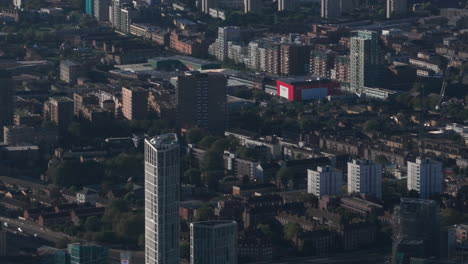 Tight-pan-up-aerial-shot-from-residential-housing-towards-canary-wharf-skyscrapers