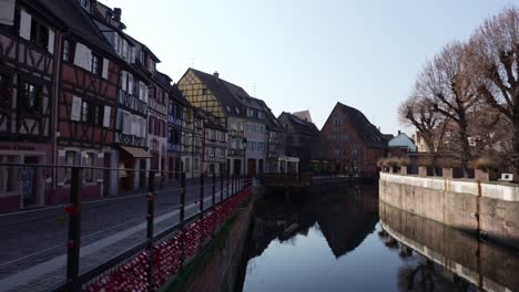 Wide-view-of-half-timbered-houses-and-the-La-Lauch-river-in-Medieval-touristic-town-in-France