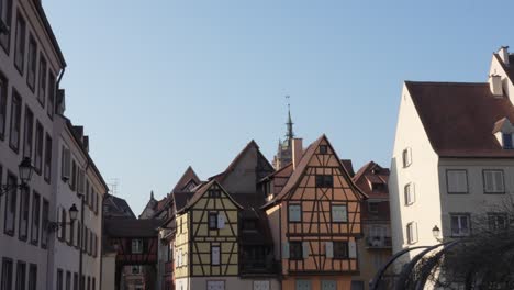 Scenic-static-shot-of-beautiful-medieval-architecture-with-a-blue-sky-in-Colmar,-France