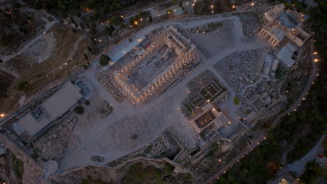 Top-down-aerial-shot-over-the-Acropolis-at-night