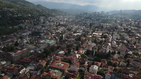 Aerial-the-view-of-the-city-of-Sarajevo-the-capital-of-Bosnia-with-tile-roofs-historical-buildings-and-street-roads