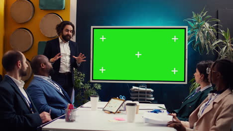 Startup-team-using-greenscreen-interactive-board-in-a-strategy-workshop-meeting
