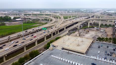 Aerial-view-of-multiple-busy-intersecting-highways,-on-an-overcast-day,-at-60-frames