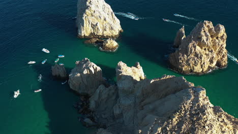 Aerial-view-around-boats-at-the-El-Arco-de-Cabo-San-Lucas,-in-sunny-Mexico