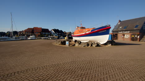 panning-wide-shot-of-an-RNLI-lifeboat-set-in-a-roundabout-at-Hythe-Marina