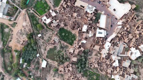 Aerial-birdseye-circling-and-rising-over-Ushaiger-Heritage-Village,-Saudi-Arabia