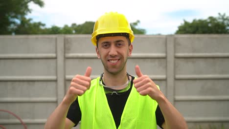 A-Construction-Worker-Wearing-a-Yellow-Hard-Hat-Expressed-Approval-by-Giving-Two-Thumbs-Up---Medium-Close-Up