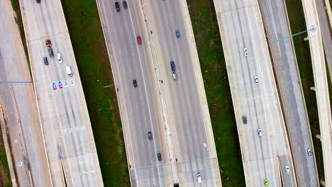 A-high-spinning-aerial-view-of-20+-lanes,-with-moderate-flowing-traffic,-at-60-frames
