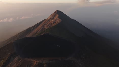 Aerial-view-backwards-away-from-a-volcanic-caldera-on-a-mountain-summit-in-Guatemala