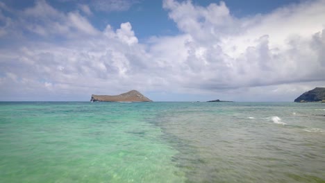 Beautiful-stone-sand-tropical-beach-with-turquoise-sea-in-Hawaii