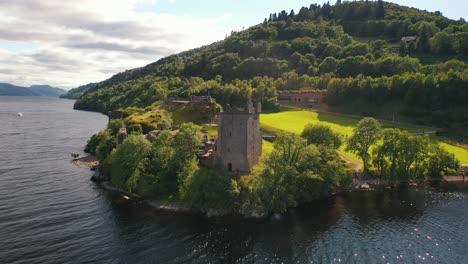 Aerial-Pan-of-Urquhart-Castle-on-Loch-Ness-in-Scottish-Highlands,-Scotland