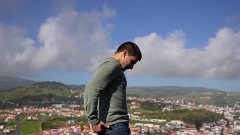 Man-contemplating-the-volcanic-landscape-of-Horta-from-Monte-da-Guia