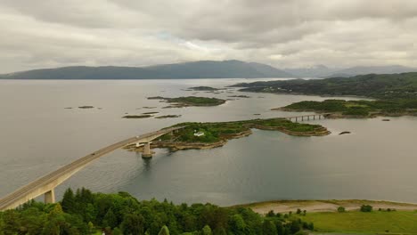 Scottish-Islands-Link:-The-Skye-Bridge-Over-Loch-Alsh,-Aerial-Majesty-of-the-Scottish-Highlands,-West-Coast-of-Scotland,-United-Kingdom