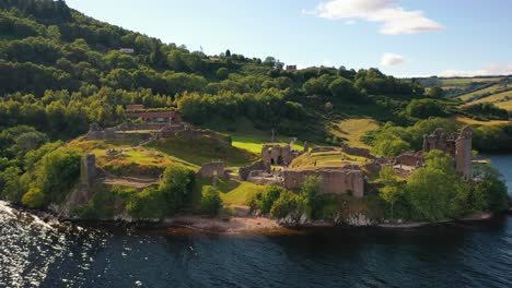 Close-Up-Aerial-on-Loch-Ness-of-Urquhart-Castle,-Scotland
