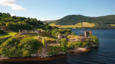 Aerial-Pan-of-Urquhart-Castle-on-Loch-Ness-in-Scottish-Highlands,-Inverness,-Scotland