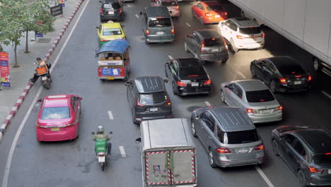 View-from-above-of-a-slow-moving-traffic-in-the-middle-of-the-city-of-Bangkok,-Thailand