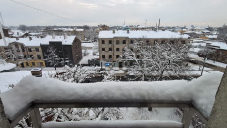 Balcony-view-of-snowy-winter-city-in-Latvia